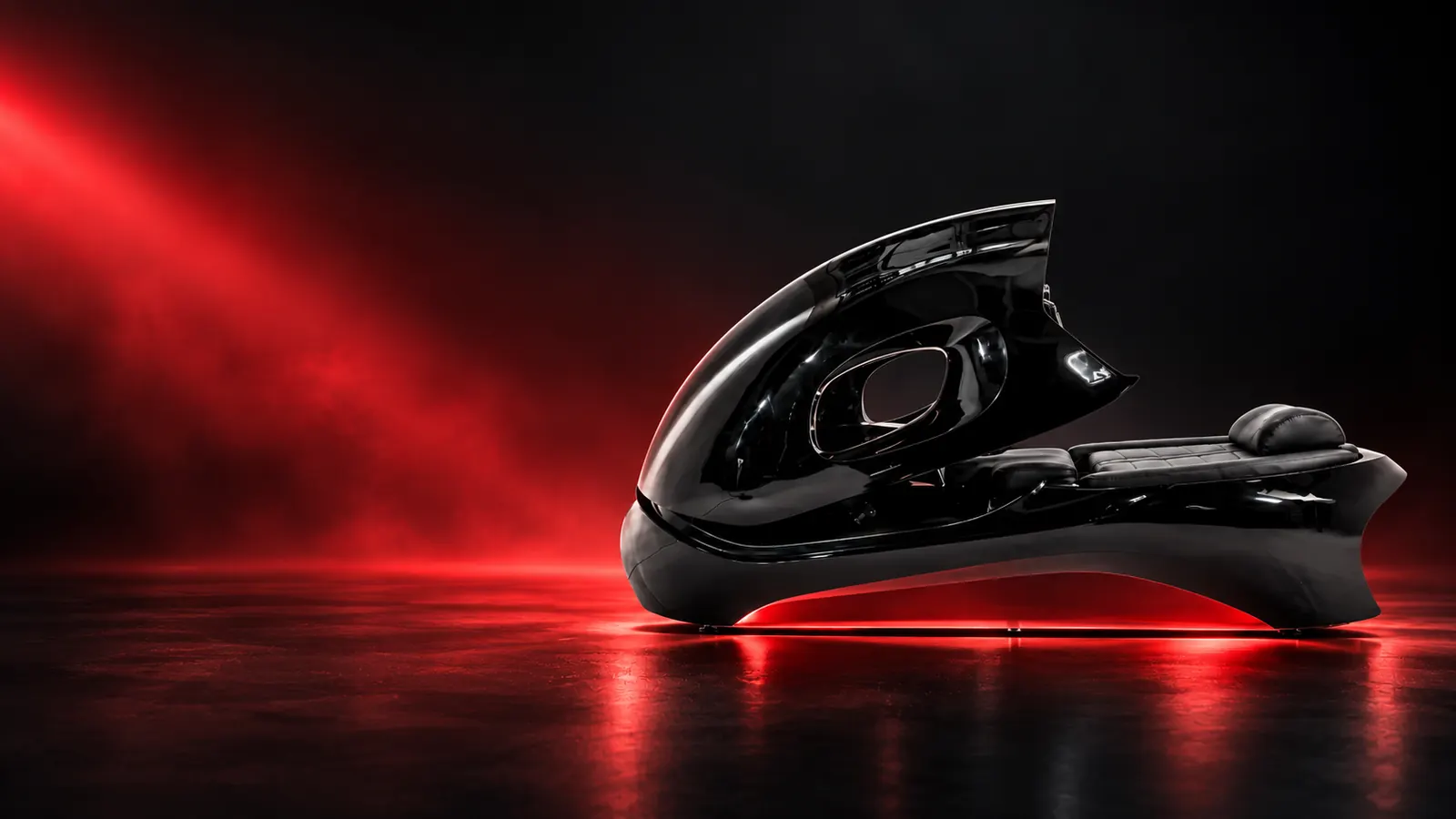 L’InfraBike, vélo allongé sous une coque noire, dans une lumière rouge
